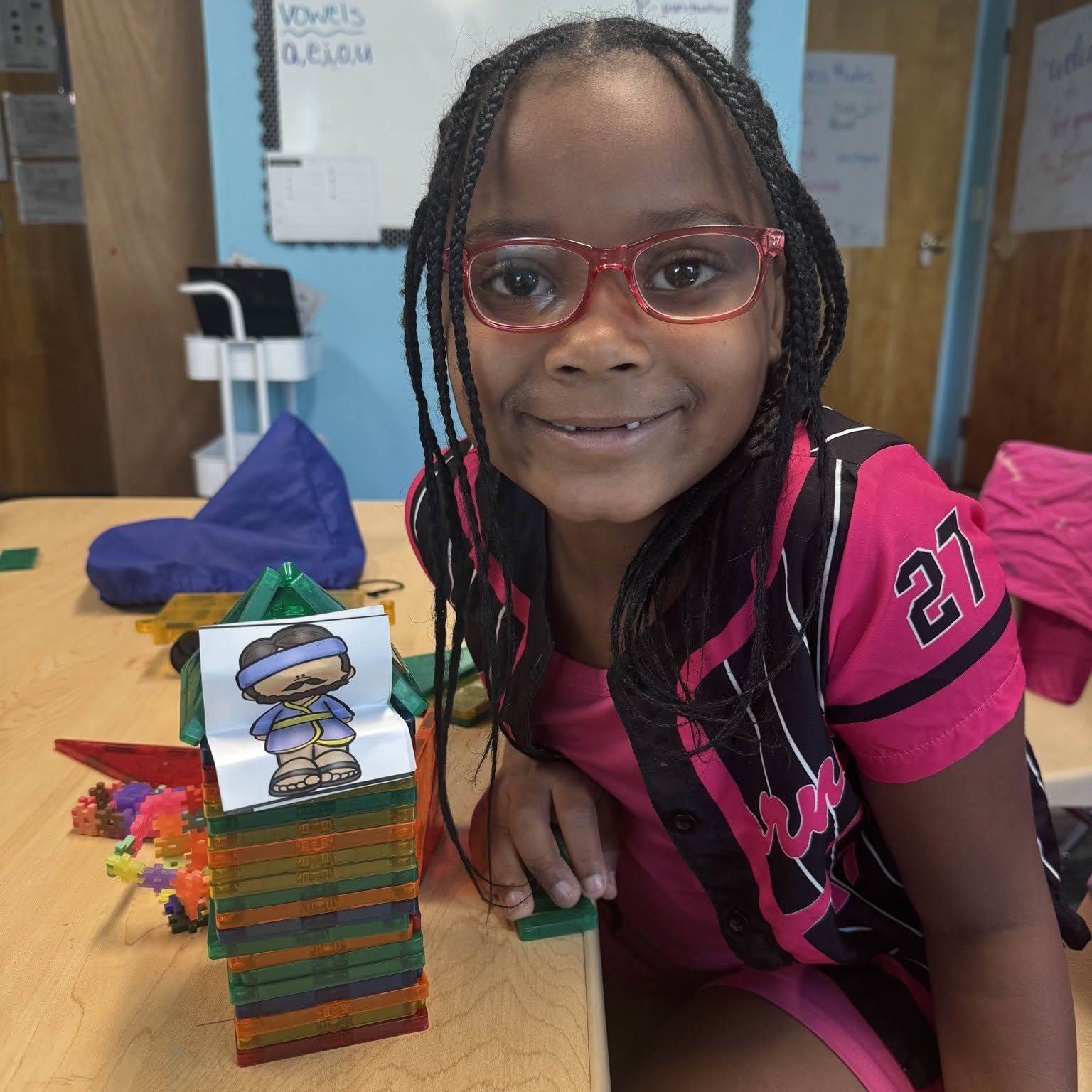 Urban Promise Academy student building with blocks